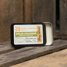 Load image into Gallery viewer, Duke Cannon Supply Co. Solid Cologne for Men Bay Rum (Citrus Musk, Cedarwood, Island Spice) - Concentrated Balm, Travel-Friendly Convenient Tin, Made with Natural & Organic Ingredients 1.5 oz (1 unit)