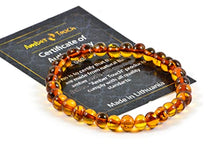 Load image into Gallery viewer, Baltic Amber Bracelet for Adults Made on Elastic Band – Carpal Tunnel, Arthritis, Headache, Migraine Pain Relief (Cognac, 7.5 inch.)