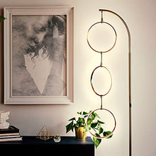 Load image into Gallery viewer, Brightech Nova Modern Floor Lamp - Contemporary Arc Tall Lamp with 3-Circle Ring-Style Pendant - Over The Couch Standing Lamp on Arching Pole - Eclectic Tall Lamp Matches Living Room Décor - Gold