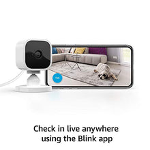Load image into Gallery viewer, Introducing Blink Mini – Compact indoor plug-in smart security camera, 1080 HD video, motion detection, Works with Alexa – 1 camera