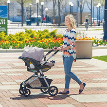Load image into Gallery viewer, Evenflo Pivot Modular Travel System, Lightweight Baby Stroller, Sleek & Versatile, Easy Infant Car Seat Transfer, Oversized Storage Basket, Blanket Boot, Travel Stroller, 3-Panel Canopy, Sandstone Tan