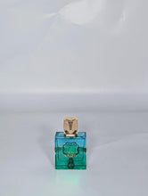 Load image into Gallery viewer, French Avenue Aromatix Sun Kissed Eau De Parfum, Woody Aromatic Unisex Fragrance, 3.4 fl oz, with Pomelo, Tea and Cedarwood Notes, Turquoise Glass Bottle with Gold Accents
