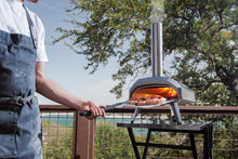 Load image into Gallery viewer, Ooni Karu 12 Multi-fuel Outdoor Portable Pizza Oven - Reaches 950°F and Cooks 12 Inch Pizzas in 60 Seconds. Versatile Wood or Propane Gas Fired Grill with Pizza Stone
