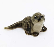 Load image into Gallery viewer, WitnyStore Sea Otter Figurines - Collectible Animal Art - Miniature Hand Made and Painted Porcelain Table Decor Perfect for Gifts and Souvenirs - 1 1/4" L x 1/2" H x 1/2" W

