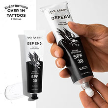Load image into Gallery viewer, Mad Rabbit Defend Tattoo Sunscreen - SPF 30 100mL Tube - Natural Sunscreen For Tattoos - Tattoo Fade Protection Under The Sun and Moisturizer with Natural Ingredients
