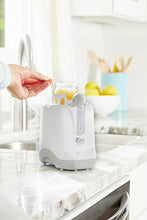 Load image into Gallery viewer, The First Years 2-in-1 Simple Serve Bottle Warmer | Quickly Warm Bottles of Breastmilk or Formula | Sanitize Pacifiers | Compact Design | Holds Wide Narrow and Angled Bottles
