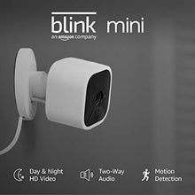 Load image into Gallery viewer, Introducing Blink Mini – Compact indoor plug-in smart security camera, 1080 HD video, motion detection, Works with Alexa – 1 camera
