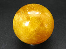 Load image into Gallery viewer, Incredible Agni Golden Yellow Danburite Cats Eye Sphere Ball from Tanzania - 1.9" - 156 Grams
