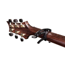 Load image into Gallery viewer, D’Addario NS Tri-Action Capo, Black – For 6-String Electric and Acoustic Guitars – Micrometer Tension Adjustment for Buzz-Free, In-Tune Performance - Single Hand Use – Integrated Pick Holder
