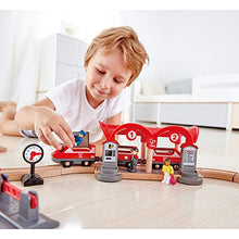 Load image into Gallery viewer, Hape Busy City Train Rail Set | Complete City Themed Wooden Rail Toy Set for Toddlers with Passenger Train, Freight Train, Station, Play Figurines, and More, Multicolor, Model:E3730
