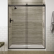 Load image into Gallery viewer, KOHLER Levity® Sliding Shower Door, 74-in H X 56-5/8 - 59-5/8-in W, with 1/4-in Thick Crystal Clear Glass with vertical blade handles, Anodized Dark Bronze
