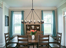 Load image into Gallery viewer, Kira Home Jericho 48" 16-Light Large Rustic Farmhouse Wagon Wheel Chandelier, Round Kitchen Island Light, Textured Black Accents + Warm Oak Wood Style Finish
