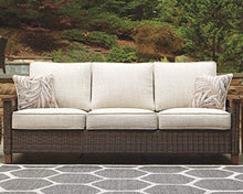 Load image into Gallery viewer, Signature Design by Ashley Paradise Trail Outdoor Patio Sofa with Cushion and 2 Pillows, Brown &amp; Beige
