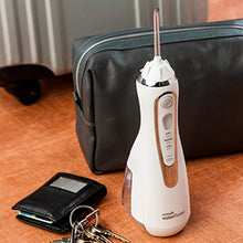 Load image into Gallery viewer, Waterpik Cordless Advanced Water Flosser For Teeth, Gums, Braces, Dental Care With Travel Bag and 4 Tips, ADA Accepted, Rechargeable, Portable, and Waterproof, White WP-560
