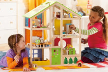 Load image into Gallery viewer, All Seasons Kids Wooden Dollhouse by Hape | Award Winning 3 Story Dolls House Toy with Furniture, Accessories, Movable Stairs and Reversible Season Theme L: 23.6, W: 11.8, H: 28.9 inch

