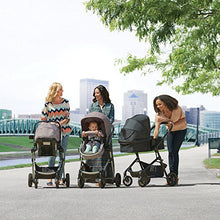 Load image into Gallery viewer, Evenflo Pivot Modular Travel System, Lightweight Baby Stroller, Sleek &amp; Versatile, Easy Infant Car Seat Transfer, Oversized Storage Basket, Blanket Boot, Travel Stroller, 3-Panel Canopy, Sandstone Tan
