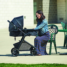 Load image into Gallery viewer, Evenflo Pivot Modular Travel System, Lightweight Baby Stroller, Sleek &amp; Versatile, Easy Infant Car Seat Transfer, Oversized Storage Basket, Blanket Boot, Travel Stroller, 3-Panel Canopy, Sandstone Tan
