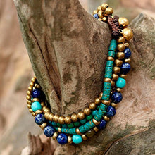 Load image into Gallery viewer, NOVICA Lapis Lazuli Brass Beaded Torsade Bracelet 'Freedom of Expression in Blue'
